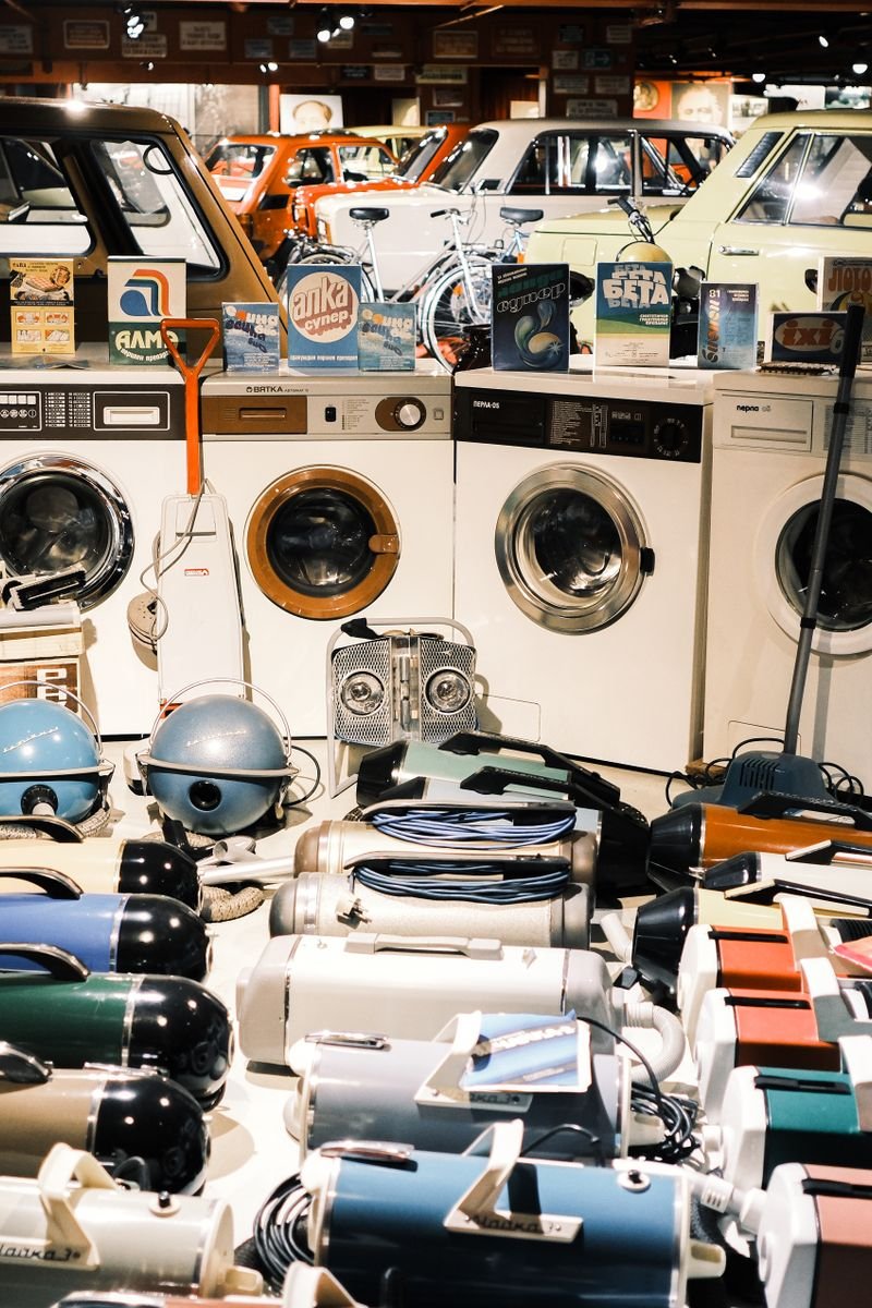 A nostalgic display of vintage washing machines and vacuum cleaners in a Bulgarian museum.