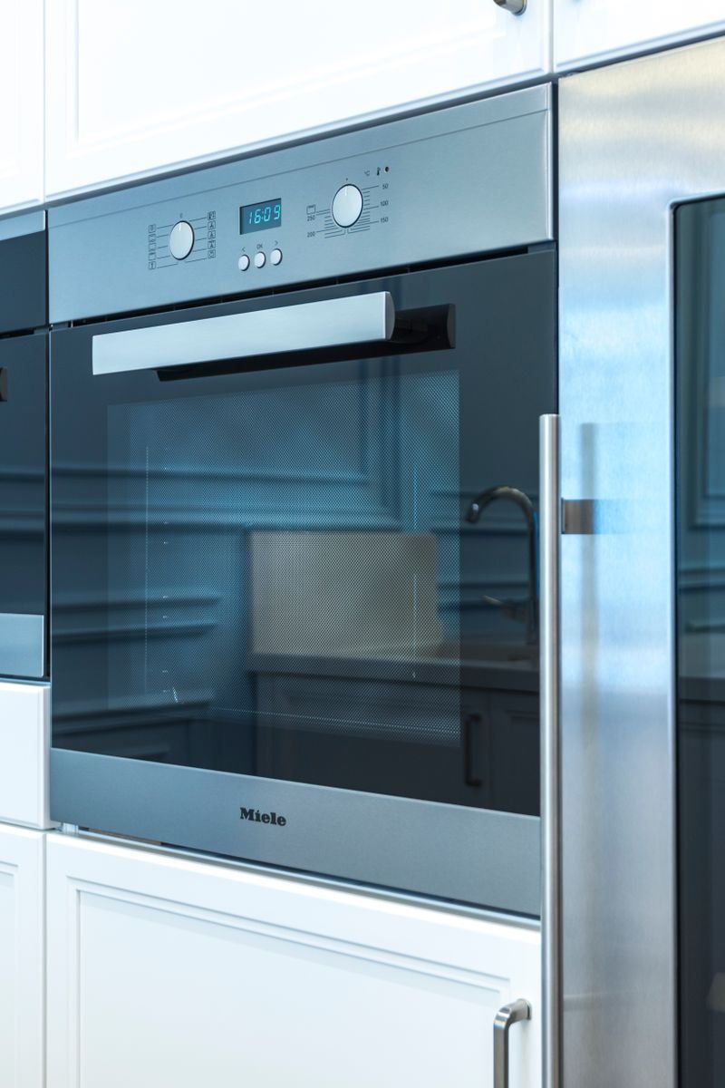 Contemporary kitchen with built-in modern appliances showcasing sleek design.